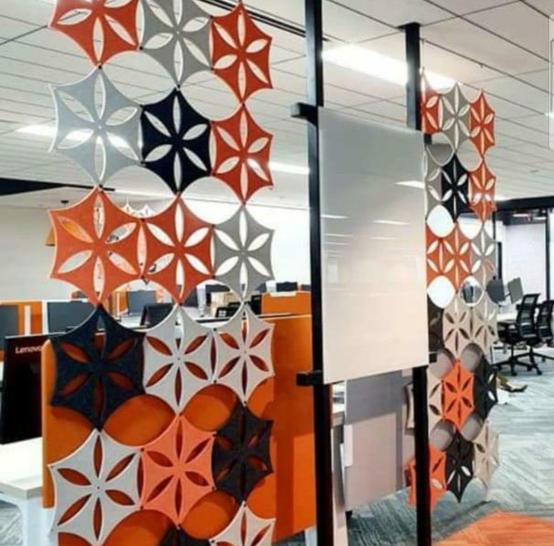 Patterned acoustic screens used as a room divider