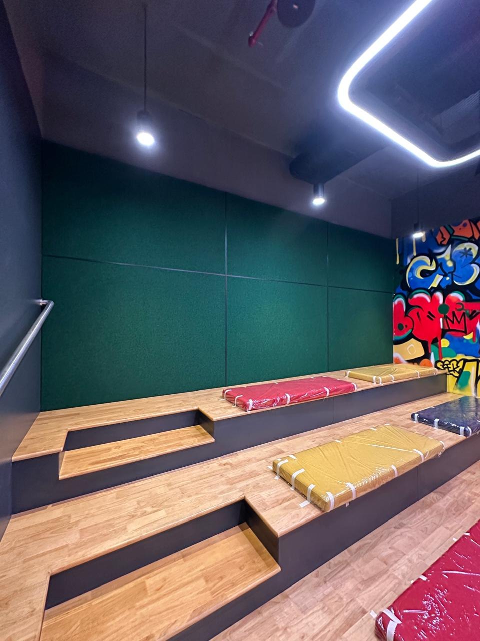 Tiered seating in an acoustically treated collaboration space